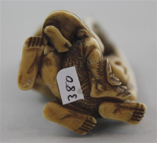 A Japanese ivory okimono of Ashinaga and Tenaga, Meiji period, 10.3cm